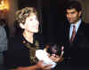 Representative Connie Morella holding newborn Isabella Vazirani. Proud father Ashish Vazirani is to her right.
