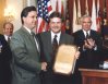 Carlton Sherwood presenting a Carlton Sherwood Media Award to John McCaslin of the Washington Times.