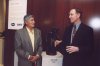 Jerry Godbehere of Pfizer and Mr. Naranjo. Mr. Naranjo's sculpture "Santa Clara Ram Dancer" is between them.